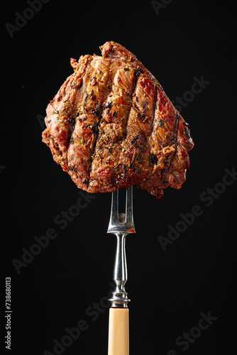  Beef steak on a fork.