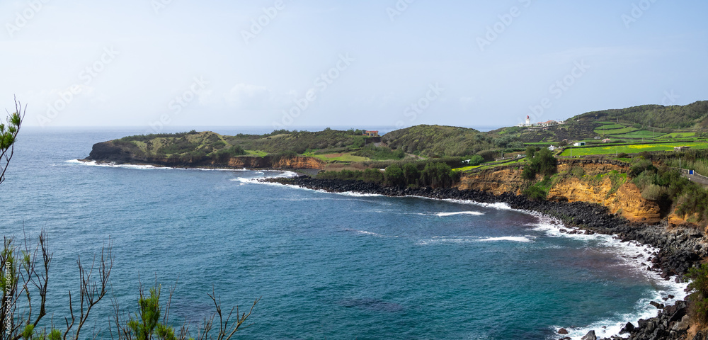 Fototapeta premium Looking south to Baia das Minas and Farol das Contendas, Terceira Island
