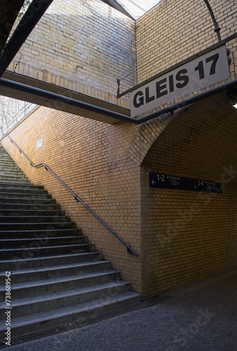 Grunewald, Germany - Feb 1, 2024: Track 17 at the Grunewald station was one of the three stations where a total of 55,000 Berlin Jews were deported during WW2. Sunny winter day. Selective focus photo