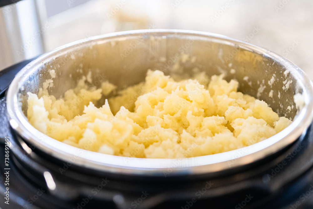 Whipping Up Creamy Mashed Potatoes in Modern Kitchen
