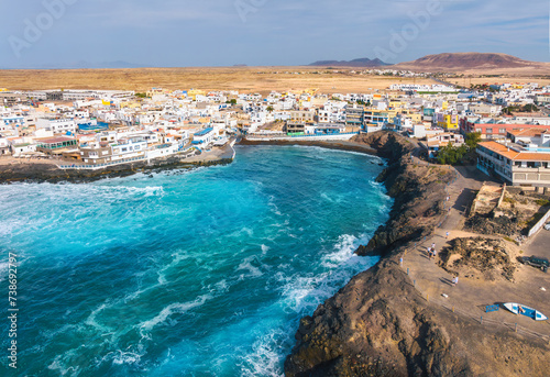 Aerial top view of the beautiful fishing village El Cotillo - La Oliva, in the summertime on the Atlantic Coast in Fuerteventura island in Spain