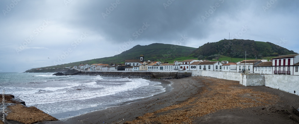 The black sand beach Praia de São Mateus, in Vila da Praia, with the Caldeira massif in background, Graciosa Island, Azores