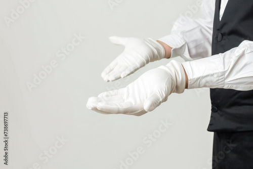 A gloved magician shows his hands
