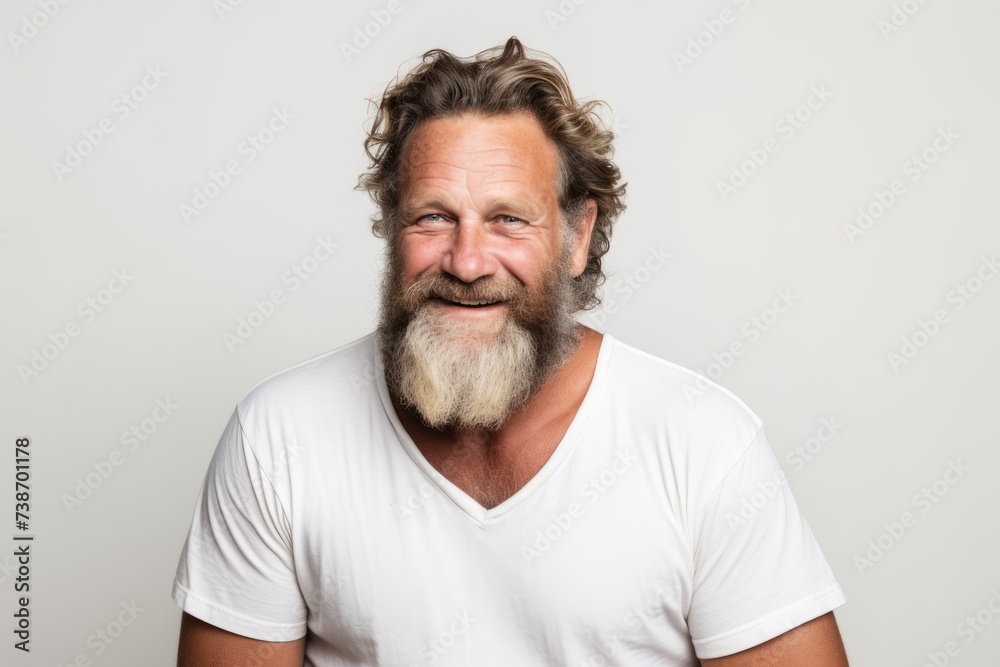 Portrait of a handsome senior man with long gray hair and beard. Portrait of a handsome senior man with long gray hair and beard.