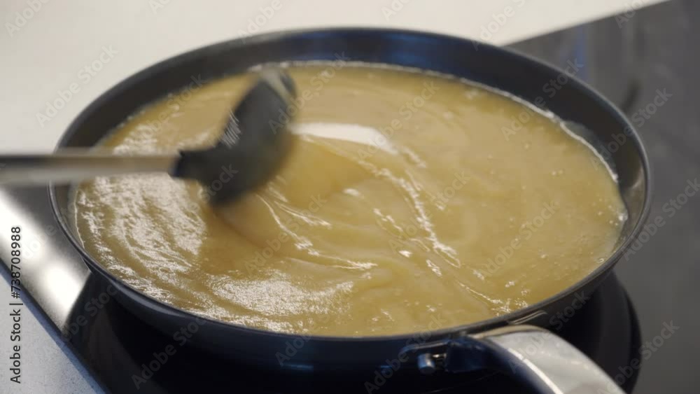 cooking apple jam process, pan with boiling jam closeup cooking apple jam process, pan with boiling jam closeup