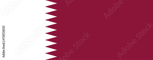 Close-up of purple and white national flag of Asian country of Qatar with zigzag pattern. Illustration made February 17th, 2024, Zurich, Switzerland. photo