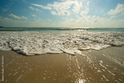 Sea beach wave splash on sand beach sunrise relax summer vacation