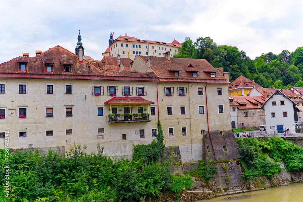 Old town with historic houses and castle on a hill at Slovenian City of Skofja Loka on a cloudy summer day. Photo taken August 9th, 2023, Skofja Loka, Slovenia. Old town with historic houses and castle on a hill at Slovenian City of Skofja Loka on a cloudy summer day. Photo taken August 9th, 2023, Skofja Loka, Slovenia.