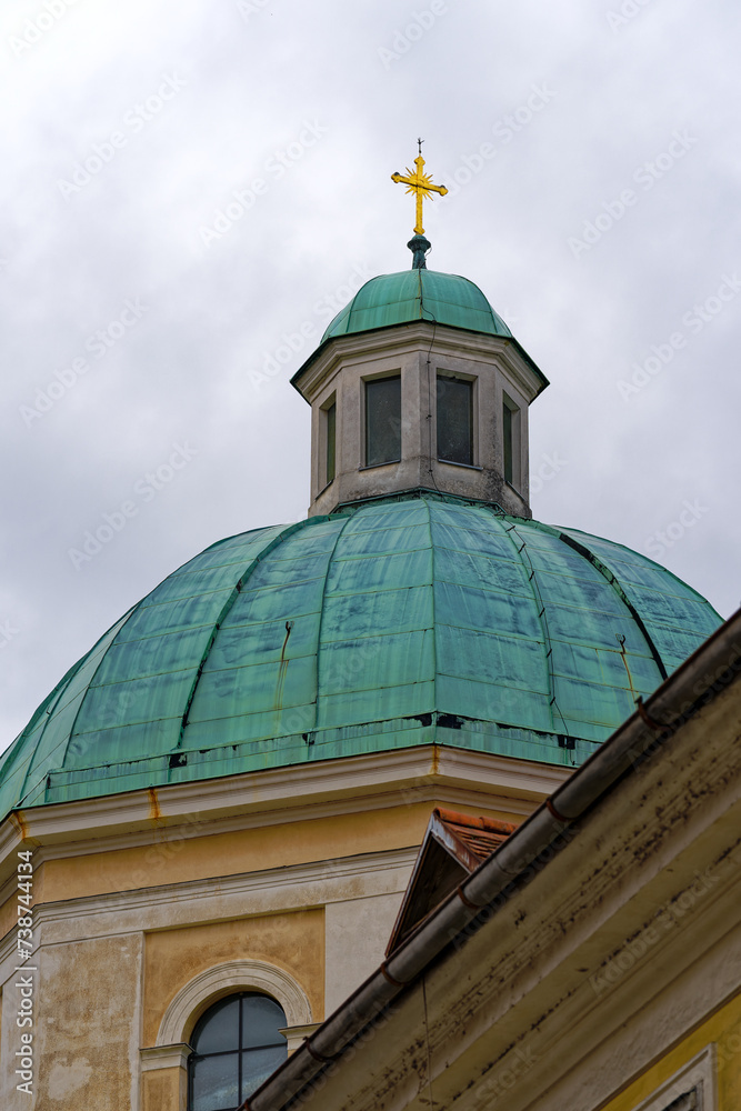 Church tower and dome of cathedral at the old town of City of Ljubljana on a cloudy summer day. Photo taken August 9th, 2023, Ljubljana, Slovenia. Church tower and dome of cathedral at the old town of City of Ljubljana on a cloudy summer day. Photo taken August 9th, 2023, Ljubljana, Slovenia.