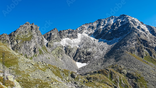 Panoramic view of majestic mountain peak Schoenbretterkogel in High Tauern National Park, Carinthia, Austria. Idyllic hiking trail in Austrian Alps. Wanderlust paradise Mallnitz. Rough alpine terrain.