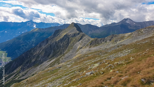 Rough terrain with scenic view of alpine valley and majestic mountain peaks in High Tauern National Park, Carinthia, Austria. Idyllic hiking trail. Austrian Alps in summer. Hike paradise Mallnitz © Chris