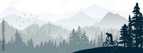 Silhouette of mountain bike rider in wild nature landscape. Mountains, forest in background. Magical misty nature. Gray illustration. photo