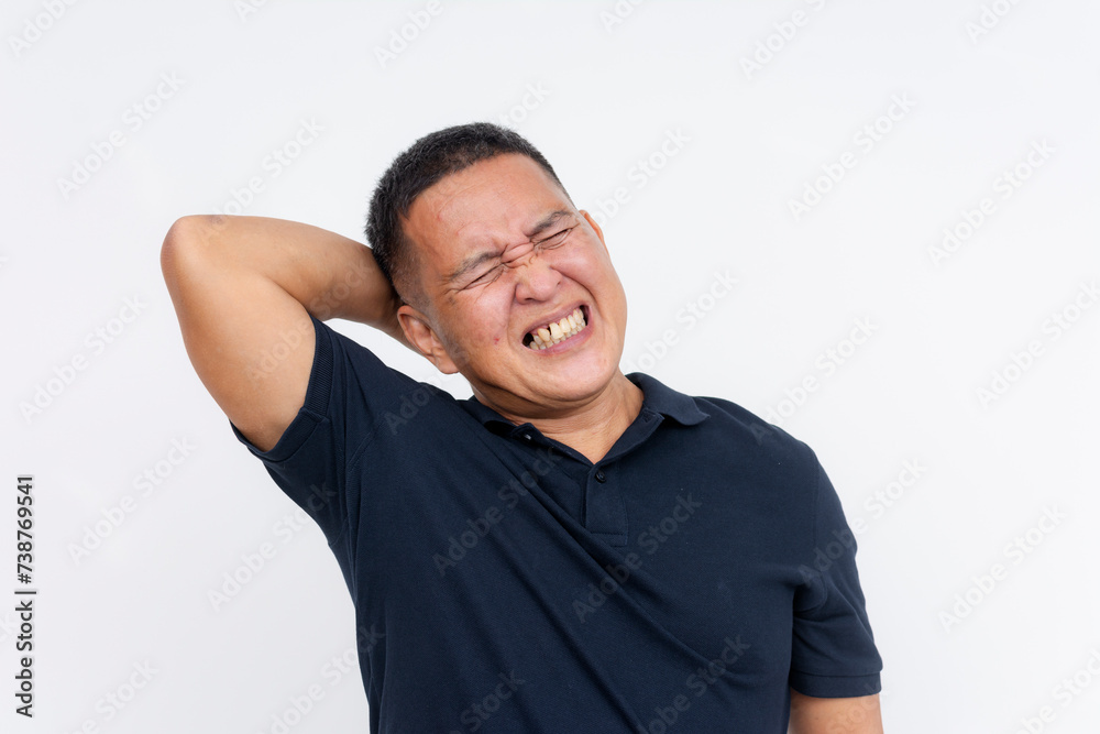 A middle-aged Asian man experiencing severe neck pain, depicting symptoms of whiplash, against a white background. A middle-aged Asian man experiencing severe neck pain, depicting symptoms of whiplash, against a white background.