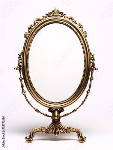 a gold oval mirror with a white background photo
