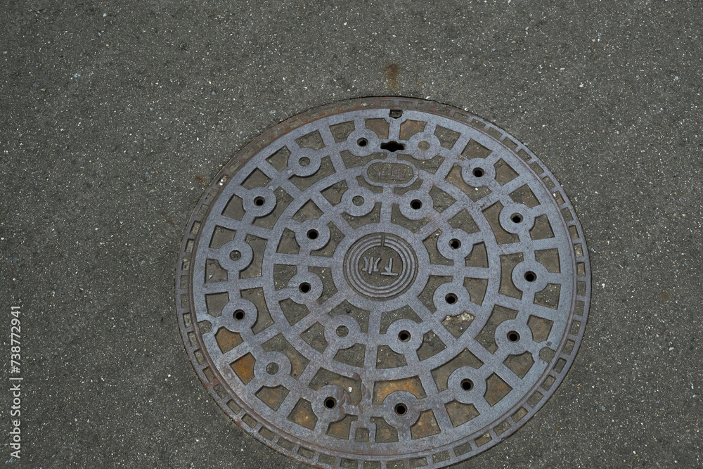 Japanese sewer manhole and asphalt