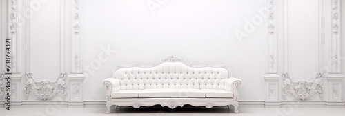 ornate white tufted sofa in the center of a white room