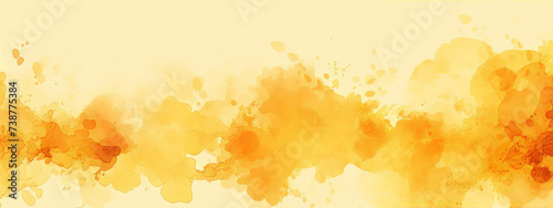 Abstract yellow watercolor background with paint splashes and blots photo