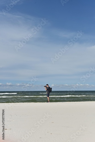 a man walking on the coast of the Baltic Sea