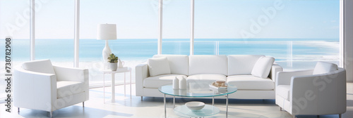 Panoramic view of a modern living room with white leather furniture and glass tables with ocean view