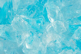 broken ice close up. pieces of crushed blue ice cracks background texture. close-up frozen water.