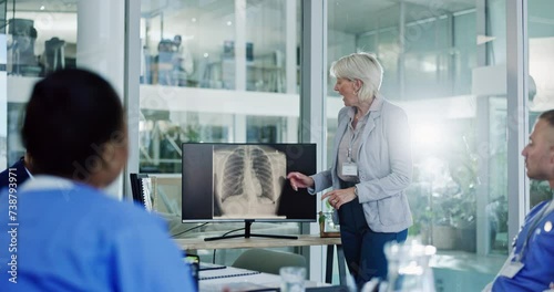 Surgeon, lungs xray or woman teaching in hospital for planning, meeting or healthcare presentation. Hand up, screen or sales representative asking medical people for medicine questions or feedback photo