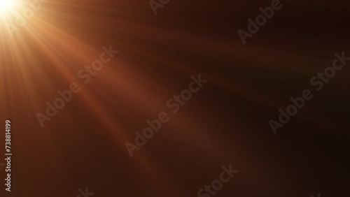 Loop of rays glow orange gold optical flare shine  light from the top left animation on black abstract background for screen project overlay. Side diagonal light optical lens flares shiny animation ar photo
