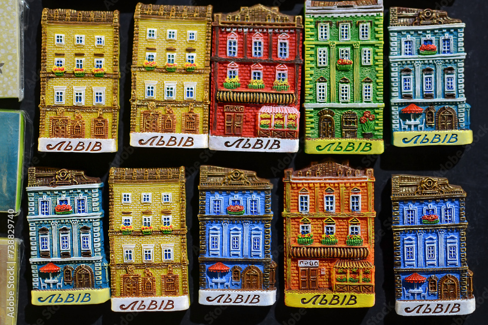 magnetic souvenirs in the form of houses on the refrigerator. translation: Lvov