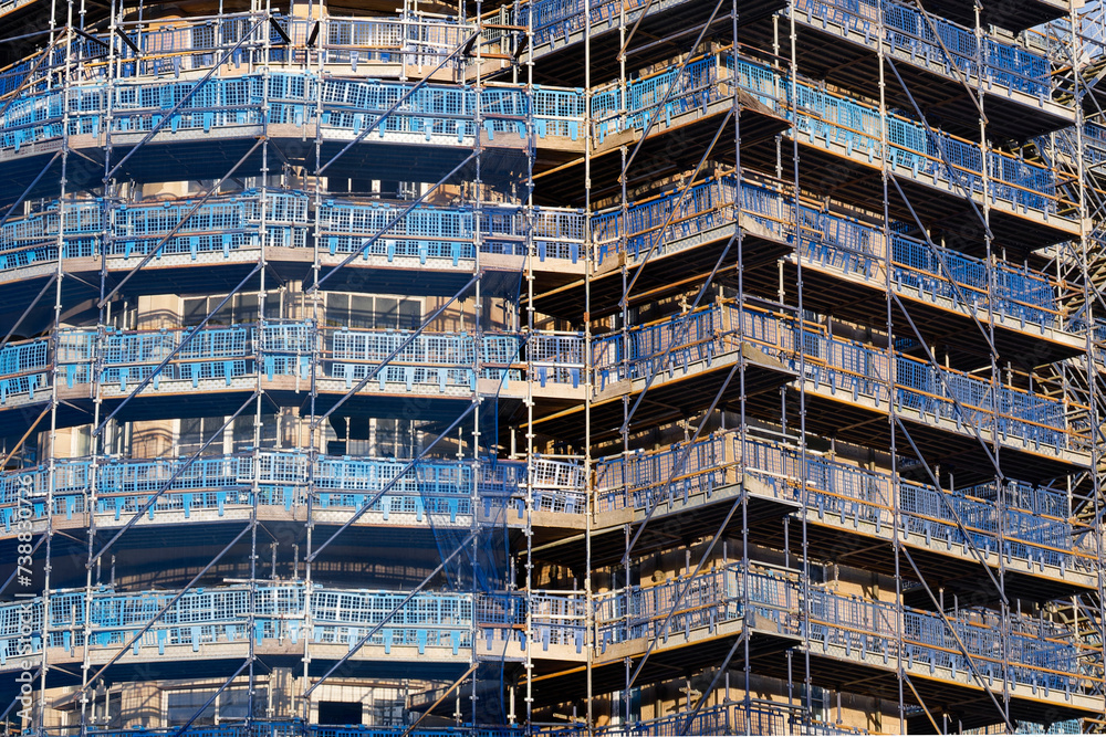 Scaffolding surrounding residential development for safe access to construction work Scaffolding surrounding residential development for safe access to construction work