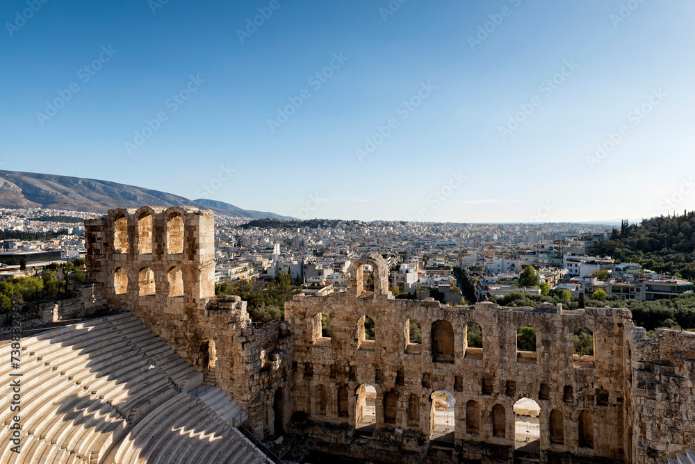 Odeon of Herodes Atticus (Herodes Theatre) and the city view in the background in Athens, Greece