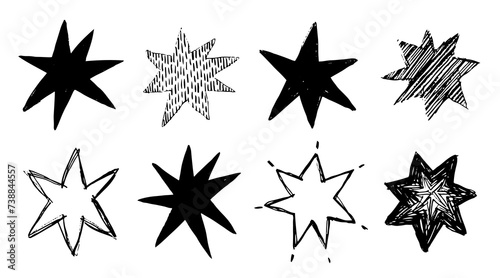 Set of black doodle-style stars drawn by hand. Grunge scrawls, charcoal scribbles, rough brush strokes, underlines and circles. Bold charcoal freehand stars. Crayon or marker scribbles photo