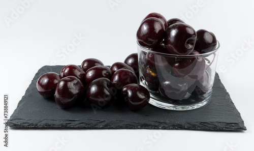 A few delicious cherries on white background.