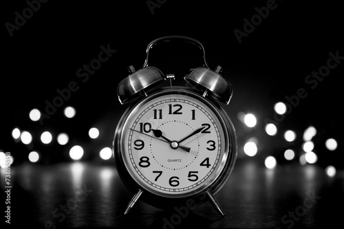 clock on black with bokeh light background