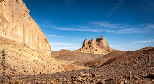 Hoggar landscape in the Sahara desert, Algeria. A view of the mountains and basalt organs that stand around the dirt road that leads to Assekrem. photo