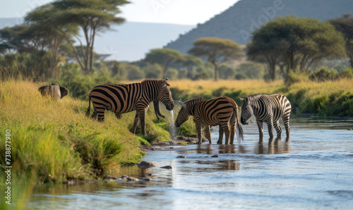 Embark on a journey through the iconic Serengeti landscape of Tanzania  Towering mountains frame vast grasslands where herds of majestic animals roam freely.