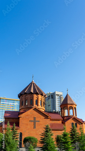 Church of St. Karapet in traditional Armenian style made of tufa. Temple of Armenian Apostolic Church in city Yekaterinburg, Sverdlovsk Region, Ural Federal District. Vertical image photo