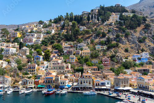 View of harbor town Symi island from high point. Greek mountainous island and municipality, part of Dodecanese island chain. Adjacent upper town Ano Symi © Olga