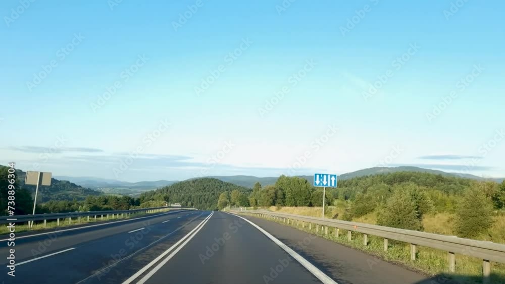 beautiful mountainous terrain. car driving on an asphalt road with a beautiful landscape beautiful mountainous terrain. car driving on an asphalt road with a beautiful landscape