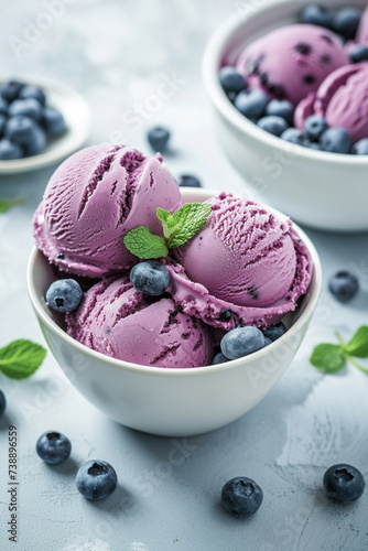 delicious blueberry ice cream in a white plate with berries
