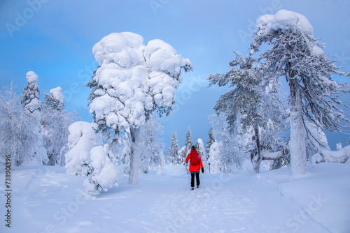 Woman hiking on snowy mountain