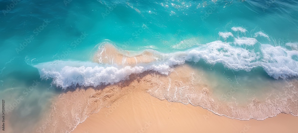 Aerial view of ocean waves, blue water, foam, white sandy beach  summer seascape from above