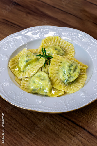 Serving Homemade Pasta Ravioli with Cow Butter Sauce