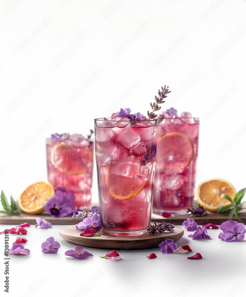 Fresh lavender lemonade with lime slices and lavender flower on white background Fresh lavender lemonade with lime slices and lavender flower on white background