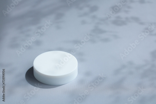 white round pedestal on a gray background. mockup  empty space  display of your product.