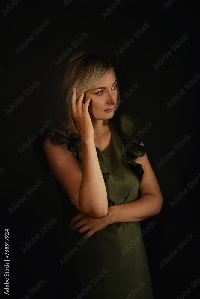 portrait of a young woman on a black background portrait of a young woman on a black background