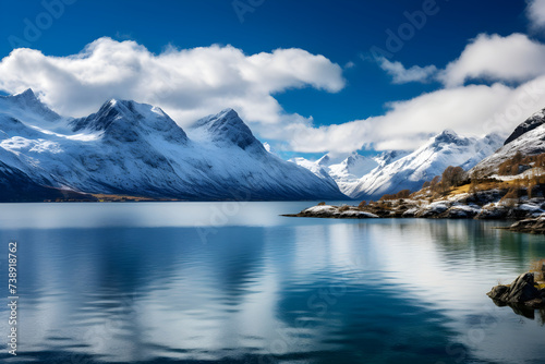 Serene Solitude: Breath Taking Picturesque Scene of Turquoise Fjord Embraced by Snow-Dusted Mountains