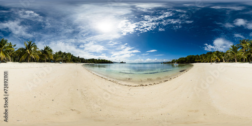 Coastline with coconut trees and clear ocean waves on sandy beach. Cobrador Island. Romblon  Philippines. VR 360.