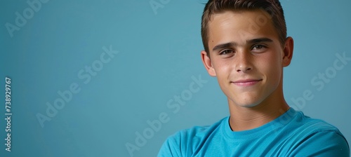 Happy young man in casual attire portrait isolated on light monochrome background with text space.