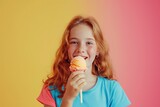 A young girl with a smile on her face is enjoying an ice cream cone on a stick