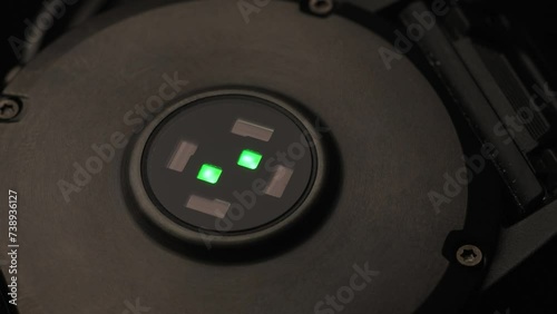 Close-up of optical heart rate sensor flashing green light