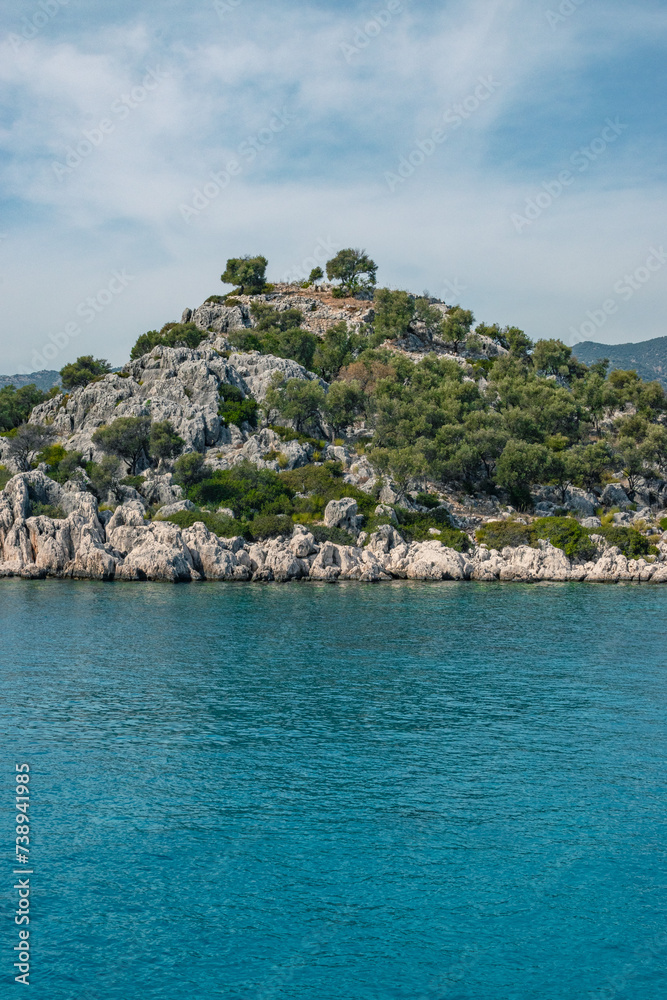 Kekova island landscape,blue water, rocks and bushes
